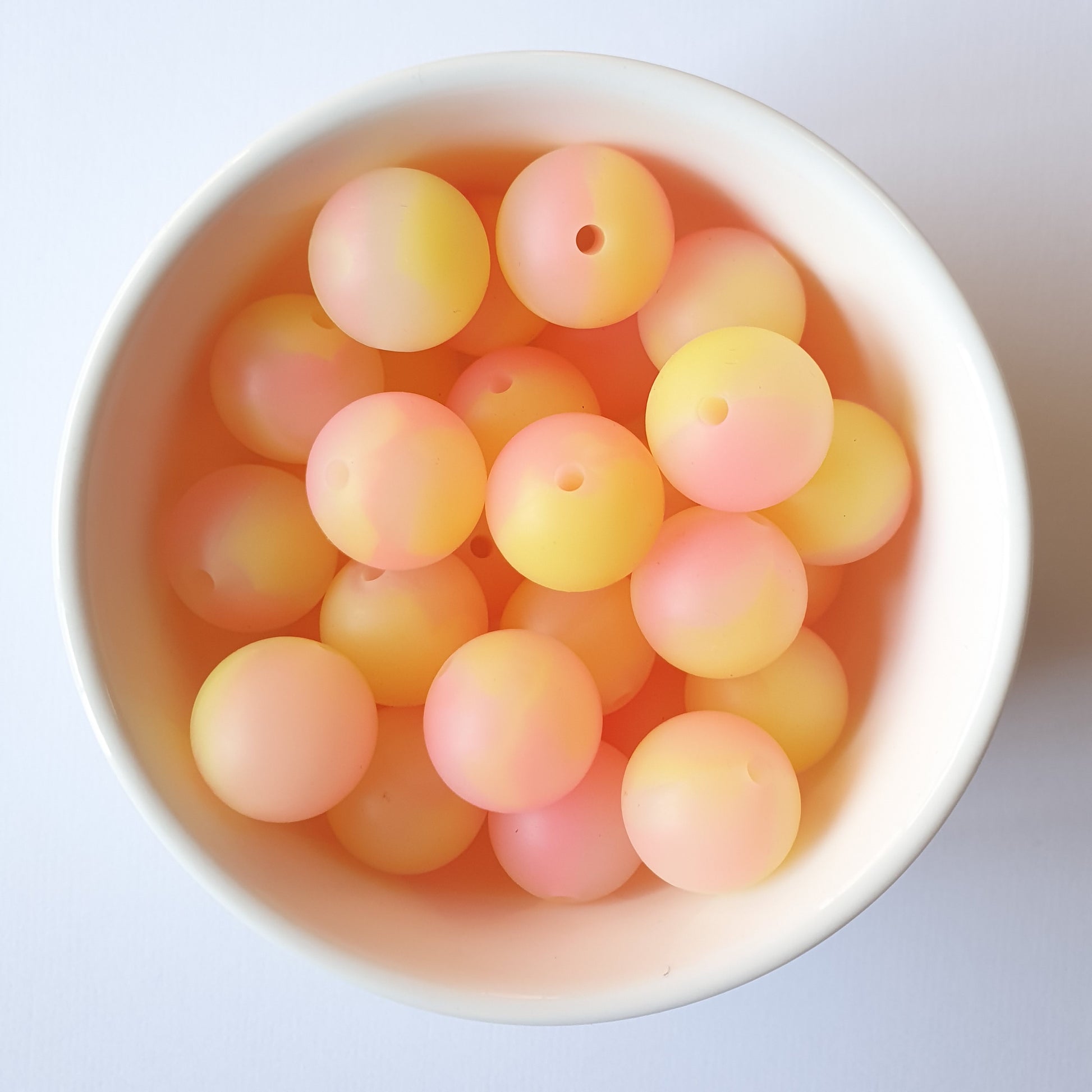Pink and Yellow glow in the dark silicone beads